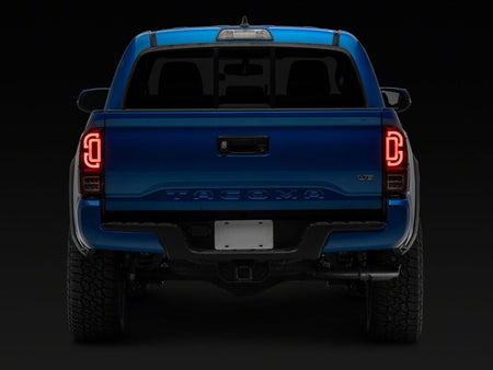 Raxiom 16-23 Toyota Tacoma XW Series Sequential LED Tail Lights- Black Housing- Red Lens